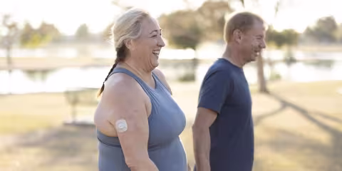 two people walking near lake