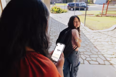 dexcom-g7-healthier-tomorrows-nia-and-mom-walking-out-the-door-with-phone-follow-app-124.jpg