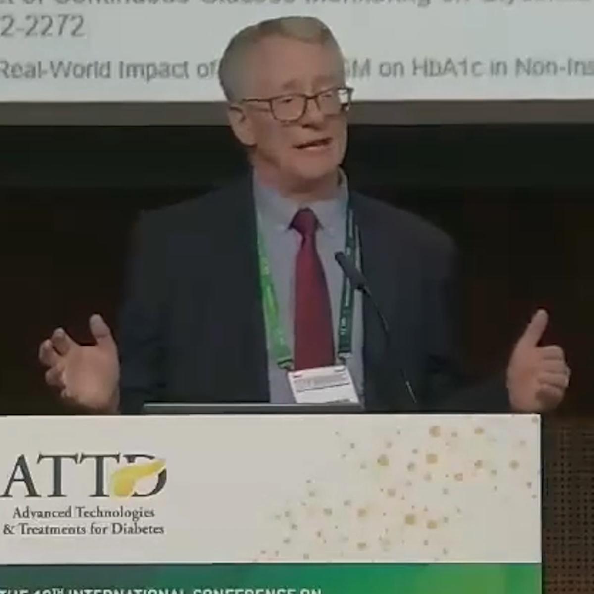 Dr.Thomas Martens speaking at podium